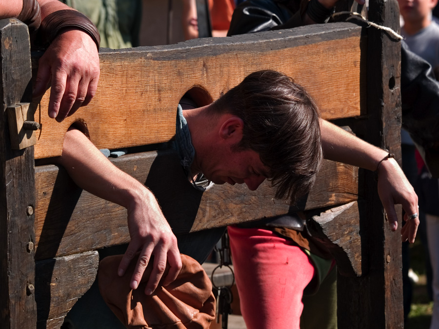 A medieval wooden pillory used for public punishment and humiliation