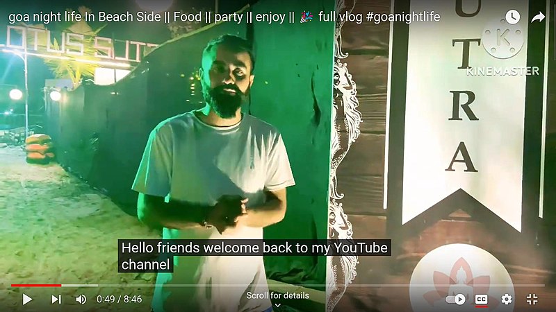 A vlogger greeting their audience directly to camera