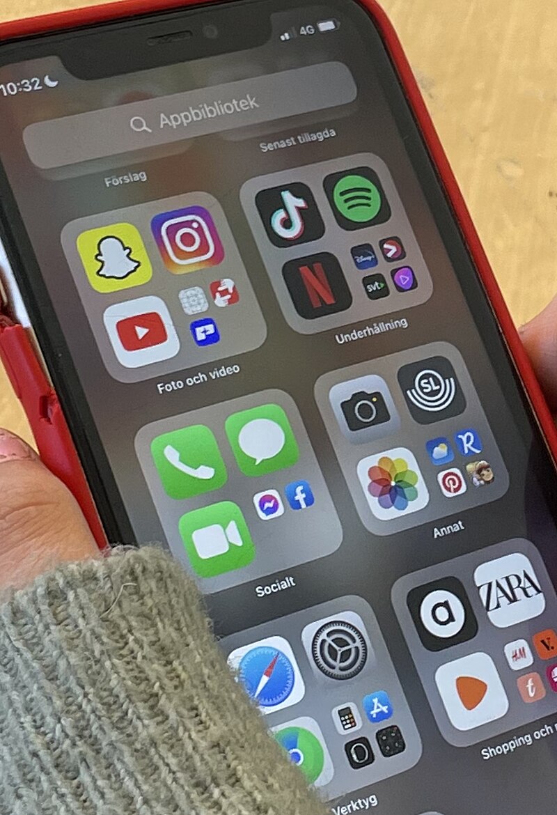 Close-up of social media apps on a smartphone screen