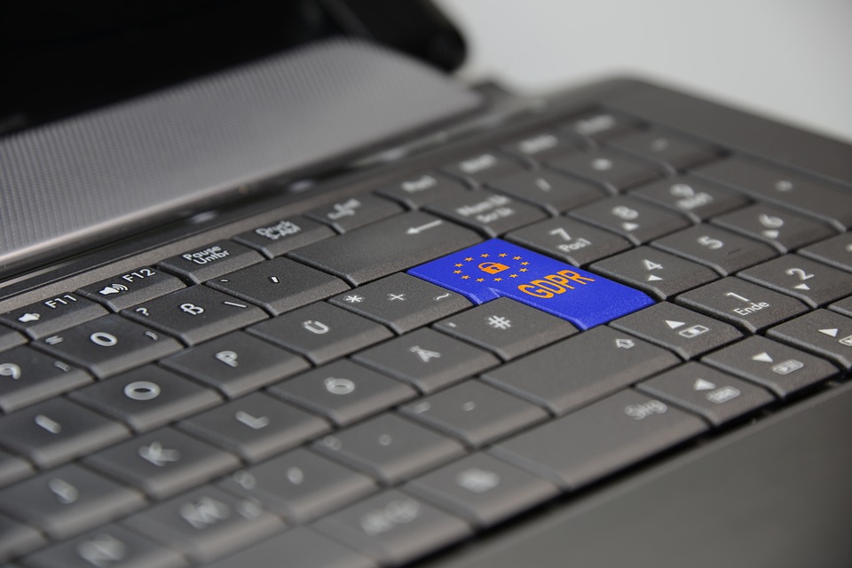 A laptop displaying GDPR regulation text, representing the European data protection law that includes the right to request erasure of personal data from search results and online records