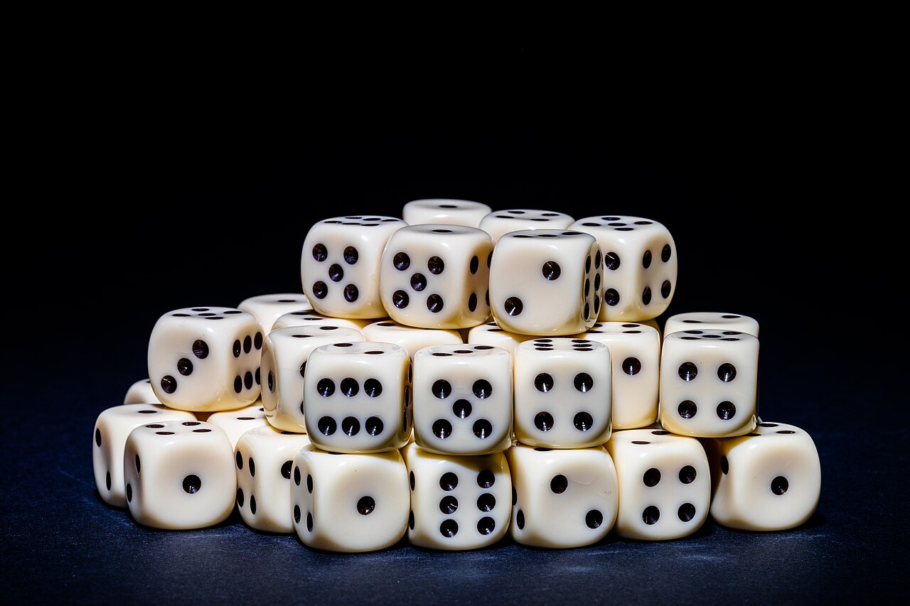 A single die, a reminder that a few rolls don't tell you the odds